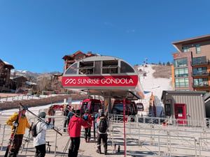 Sunrise Gondola loading area with skiers loading the lift to ski or snowboard Park City Mountain Resort.