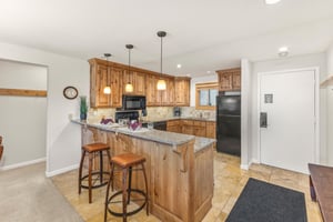 Snow Flower Condominium 14s open concept kitchen with a breakfast bar and seating for 2.