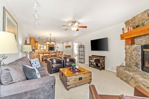 Snow Flower Condominium 14s open living room with flat screen TV and plenty of seating.