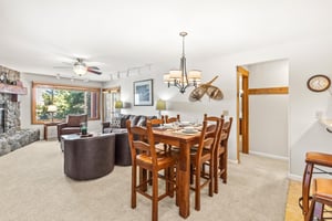 Snow Flower Condominium 14s dining room positioned next to spacious living room.