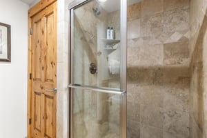 Snow Flower Condominium 14s main suite tiled shower.