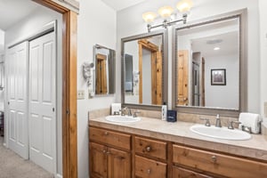 Snow Flower Condominium 14s main suite bathroom dual vanity with sinks.