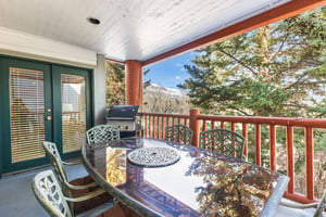 Snow Flower Condominium 14s private patio with table seating for 6 and BBQ.