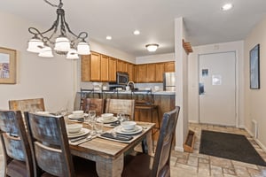 Snow Flower Condominium 147s dining room area next to open space kitchen concept.