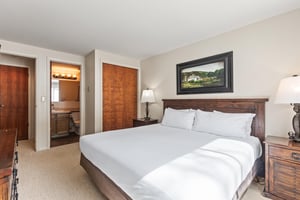 Snow Flower Condominium 147s main suite with bathroom entrance and closet.