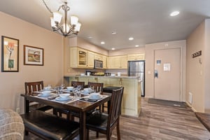 Premier Snow Flower Condominium 107s dining room for 6 next to open concept kitchen.