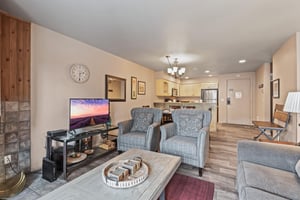 Premier Snow Flower Condominium 107s living room with flat screen TV.