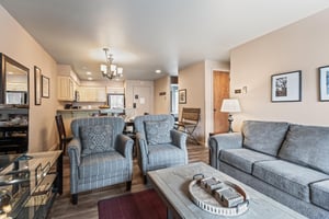 Premier Snow Flower Condominium 107s spacious living room seating.
