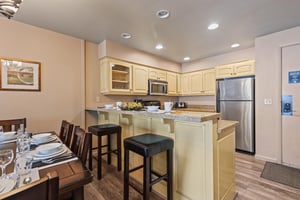 Premier Snow Flower Condominium 107s countertop seating for 2, and open concept kitchen.