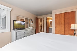 Premier Snow Flower Condominium 107s main suite with flat screen TV.