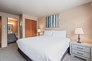 Premier Snow Flower Condominium 107s main suite with king bed.