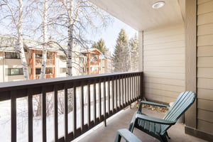 Premier Snow Flower Condominium 107s outside private patio.