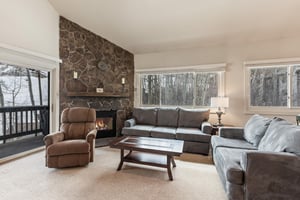 Premier Snow Flower Condominium 130s spacious living room with fire place.