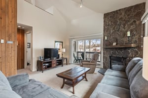 Premier Snow Flower Condominium 130s living room with flat screen TV.