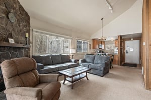 Premier Snow Flower Condominium 130s open concept living room and dining room.