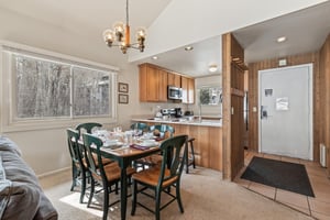 Premier Snow Flower Condominium 130s dining room and open concept kitchen.