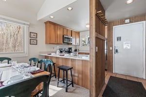 Premier Snow Flower Condominium 130s breakfast bar with seating for 2 guests.