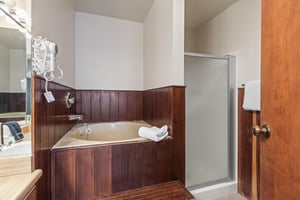 Premier Snow Flower Condominium 130s main suite bathroom with jetted tub and shower.