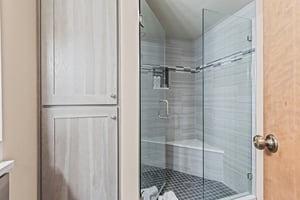 Premier Snow Flower Condominium 107s shared bathroom with walkin shower.