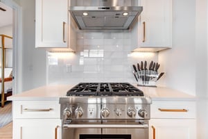 Your fullyequipped kitchen with professionalgrade gas range, sleek hood, and knife set.