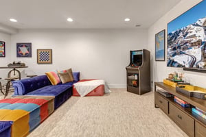 The game room awaits with cozy seating, classic arcade gaming, and board games.