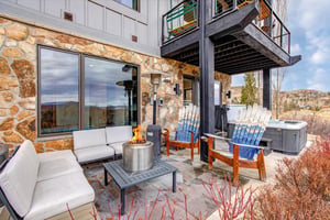 Your private patio features cozy seating around a crackling fire table.