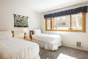 Guest bedroom with two twinsized beds