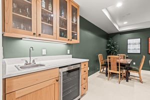 Your elegant kitchenette, perfect for preparing drinks while you relax at the nearby dining table.