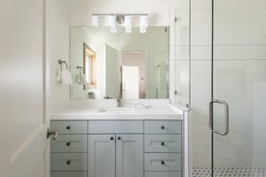 Main bedrooms ensuite bathroom with a full tiled shower and glass door.
