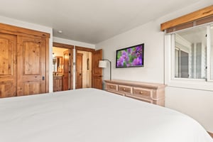 Unwind in the main suite featuring a flatscreen TV and en suite bathroom.