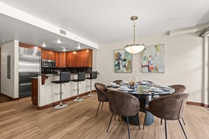 Lowell 203s openconcept dining and kitchen area featuring elegant furnishings and modern appliances.