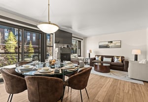 Your stylish openplan living space features with a dining area, cozy fire, and spacious living room.