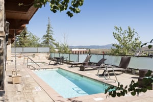 The Lowell Condominiums year round pool and jacuzzi on a sunny summer day.