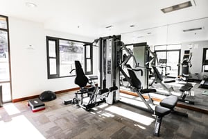 The Lowell Condominiums fitness area with weight machines.