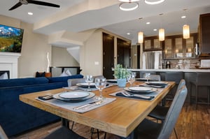 The open concept dining area with the kitchen beyond.