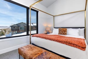 The main suite offers a king size bed and large window allowing plenty of natural light.
