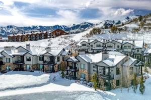 Frost Haven is nestled in the pristine snowcovered slopes in the Canyons Village with mountain backdrop.
