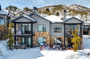 Frost Haven offers a spacious two story townhome in the Canyons Village with snowy mountains surrounding it.