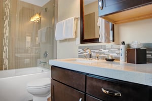 Full bathroom on main level with a bathtub and shower combination.