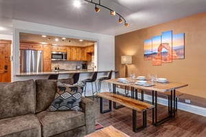 Your openconcept living and dining space features modern furnishings and a fully equipped kitchen.