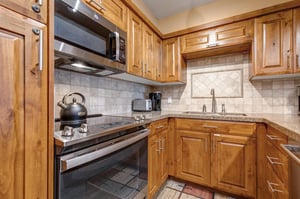 Your fully equipped kitchen features a full oven and glass stove top.