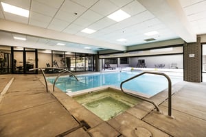 The Resort Plaza indoor pool deck with integrated hot tub