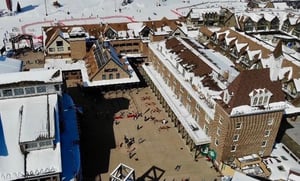 Ariel view of the Resort Plaza building, the surrounding plaza, and the skiinskiout access.