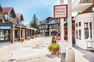 Resort Plaza condominiums entrance on a sunny summer day.
