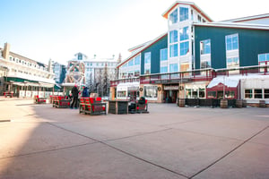 The Park City Mountain Village plaza area with seating and fire tables.