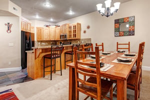 Gather around the dining table set for eight, or grab a seat at the breakfast bar in your fullyequipped kitchen—perfect for memorable meals together.