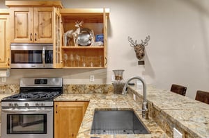 Your fully equipped kitchen features granite countertops, stainless steel appliances, and charming rustic touches that make meal prep feel like home.