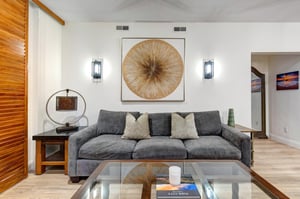 Sink into plush seating and unwind in this bright, thoughtfully designed living space.