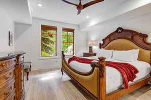 Sink into the plush comfort of your luxurious bed and wake to peaceful garden views framed by elegant woodtrimmed windows.
