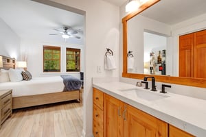 Step into your private sanctuary where warm wood tones meet modern comfort.